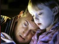 
   Bedtime stories, Sam 
   listens intently as Lucy
   (DAKOTA FANNING) reads.   
    .
    